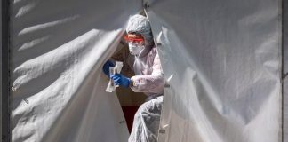 Virus cases in Russia rise by record, mortality slows