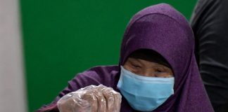 The gloves come on: virus-hit Singapore votes