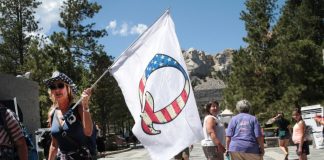 Facebook boots QAnon groups for ties to violence