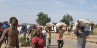 Looters raid Nigeria food warehouse as unrest spreads