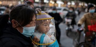 WHO team arrives in Wuhan as China reports first virus death in months